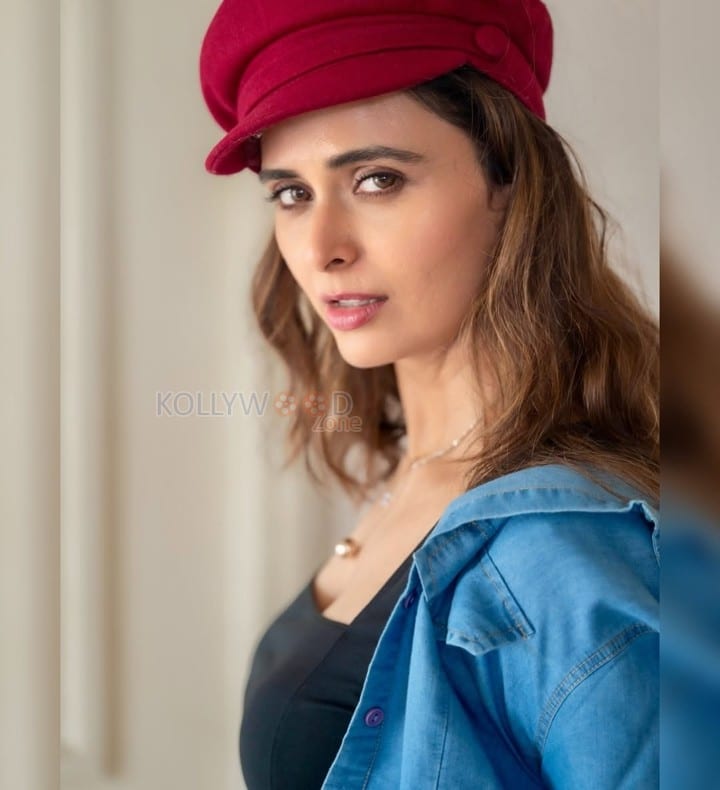 Local Train Actress Meenakshi Dixit in a Black Crop Top with a Matching Denim Mini Shorts and Jacket Photos 03