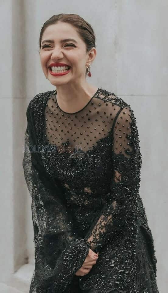 Smiling Mahira Khan in a Black Netted Dress Photo 01