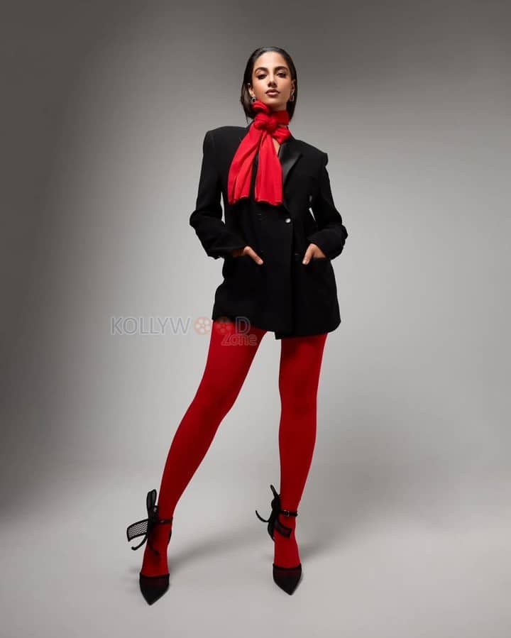 Adorable Meenakshi Chaudhary in a Black and Red Suit Photos 08