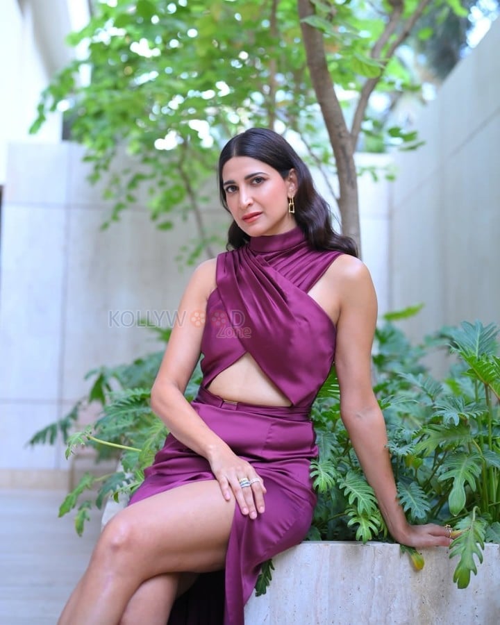 Alluring Aahana Kumra in a Maroon Floor Length Mermaid Gown with a High Neckline Cross Over Bodice and Thigh High Slit Photos 04