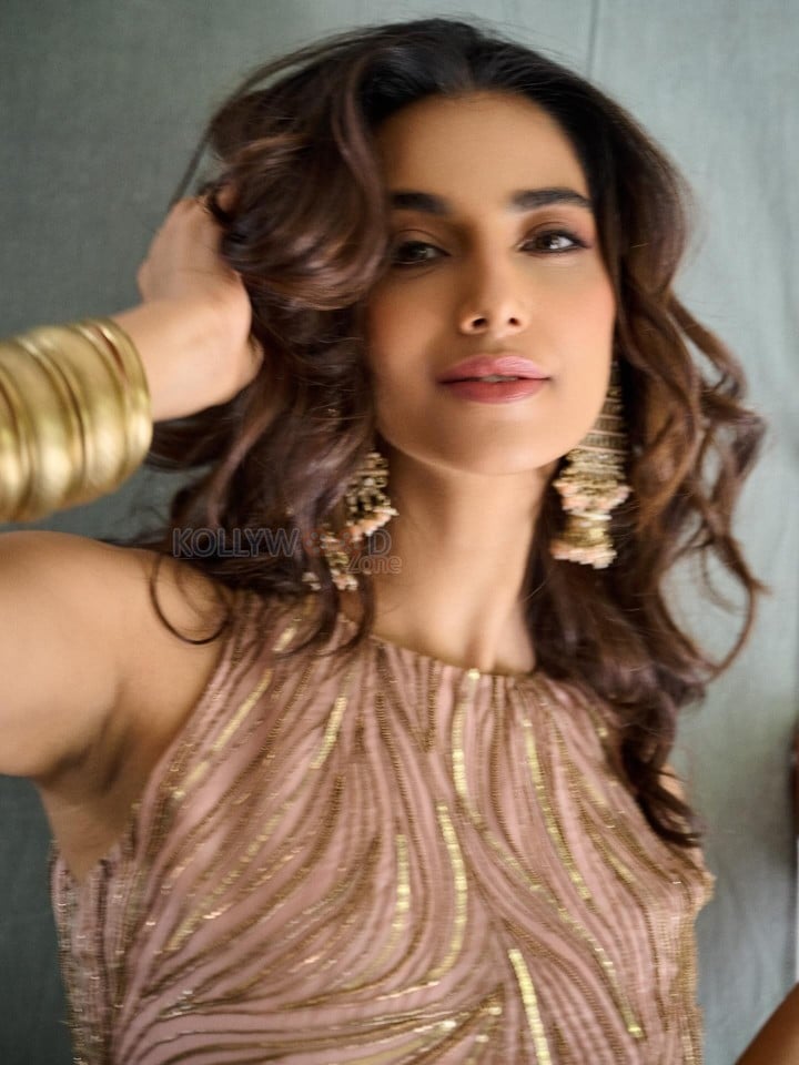 Beautiful Meenakshi Chaudhary in a Sleeveless Rose Gold Embroidered Co Ord Set Photos 03