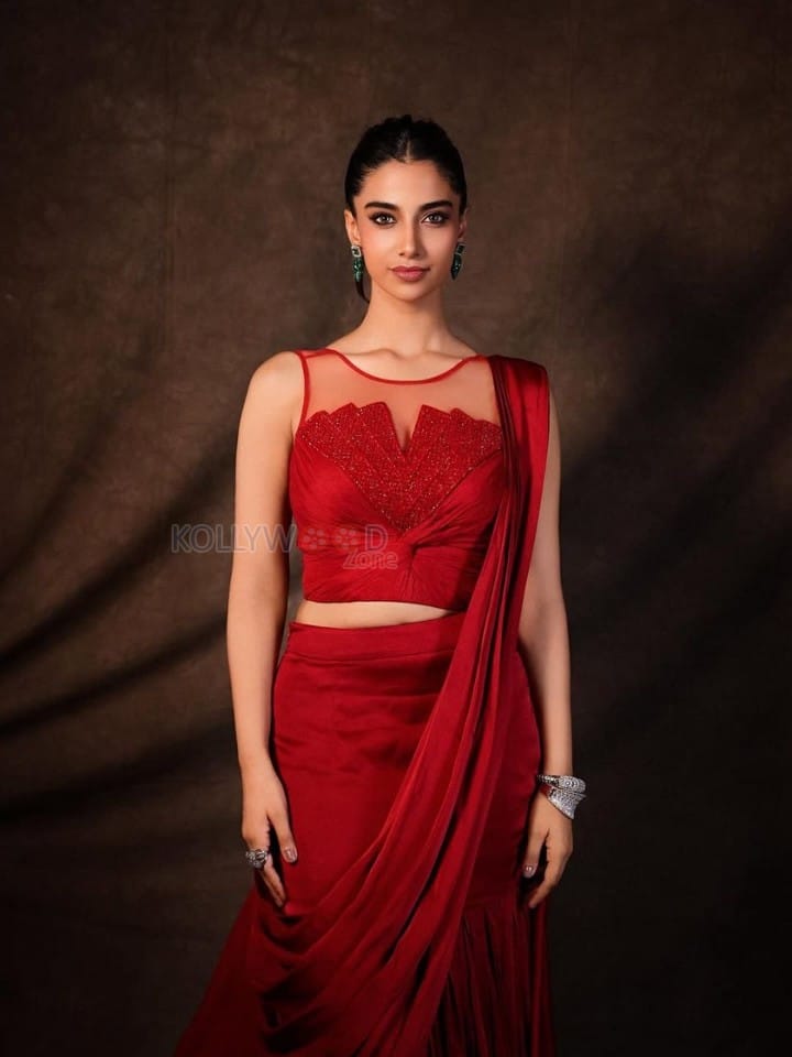 Glamorous Meenakshi Chaudhary in a Red Satin Lehenga Saree with a Embroidered Sheer Net Round Neck Photos 06