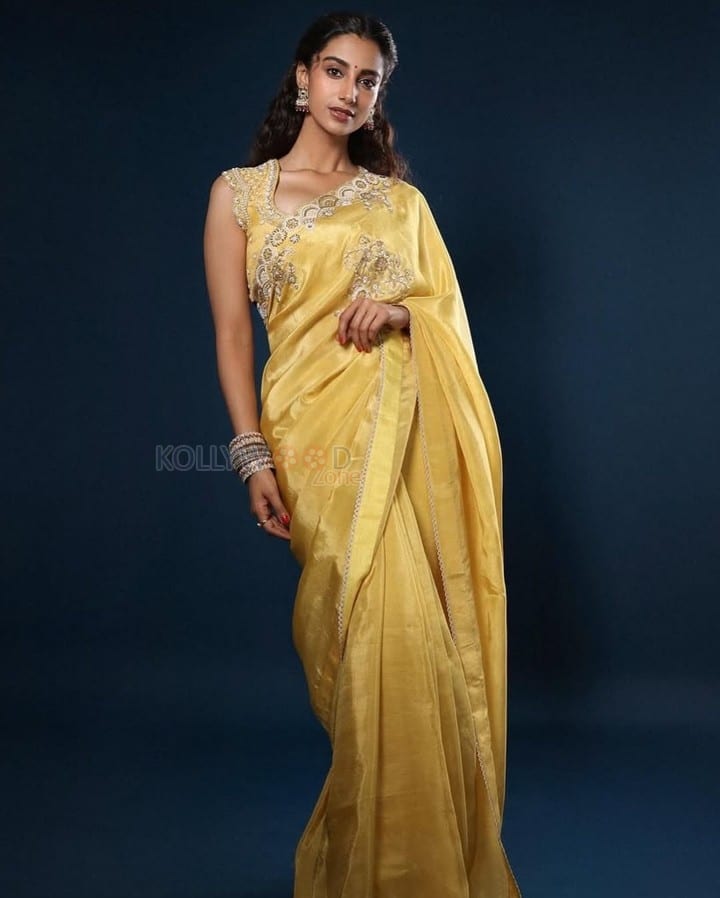 Gorgeous Meenakshi Chaudhary in a Yellow Saree with Yellow Embroidered Blouse with Floral Patterns Photos 03