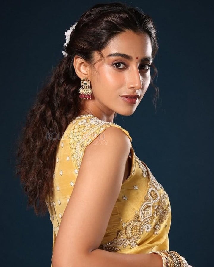 Gorgeous Meenakshi Chaudhary in a Yellow Saree with Yellow Embroidered Blouse with Floral Patterns Photos 06