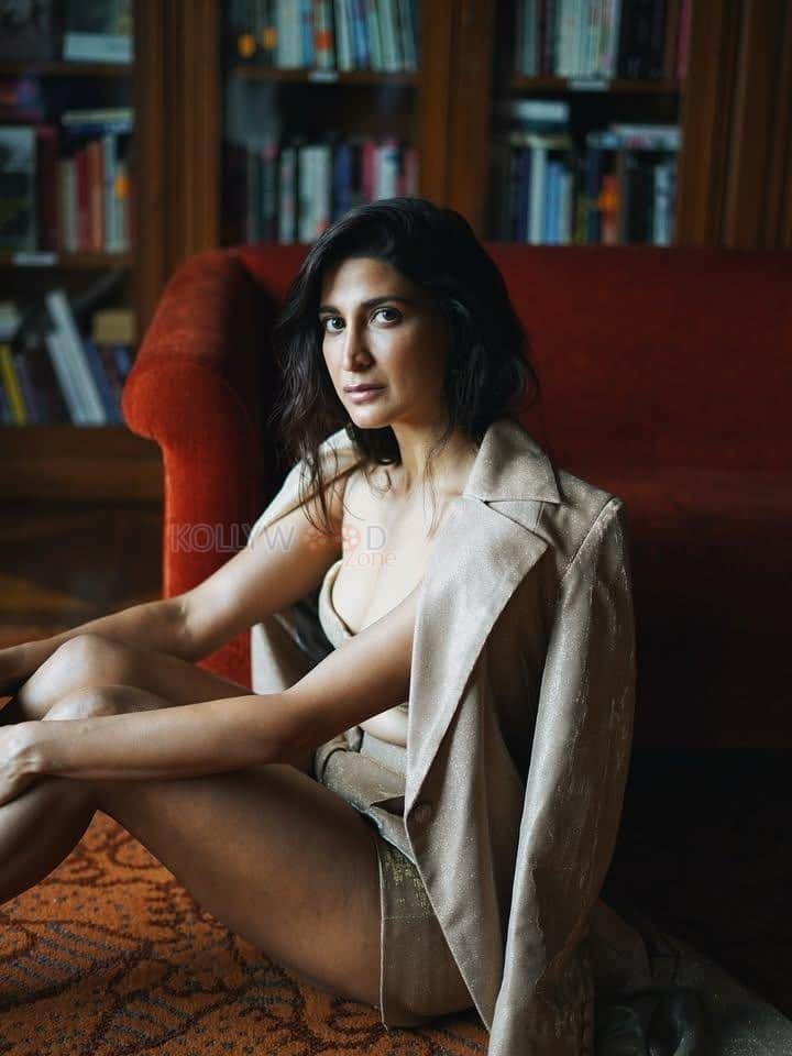 Stunning Cleavage in a Golden long Coat with a Bralette and Mini Skirt Photos 02