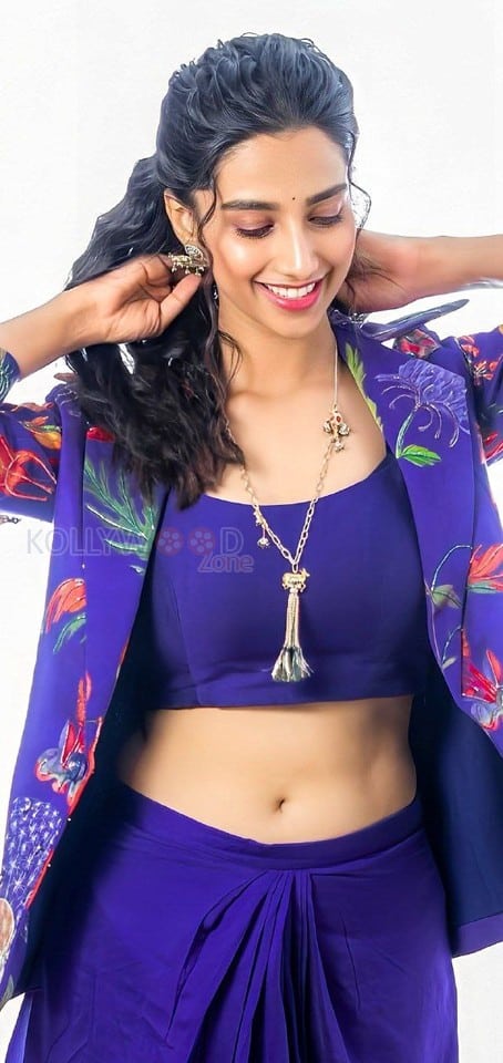 Stunning Meenakshi Chaudhary in a Vibrant Blue Bralette with Matching Skirt and a Stylish Shrug Photos 02