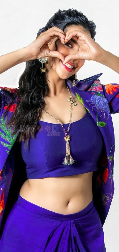 Stunning Meenakshi Chaudhary in a Vibrant Blue Bralette with Matching Skirt and a Stylish Shrug Photos 04