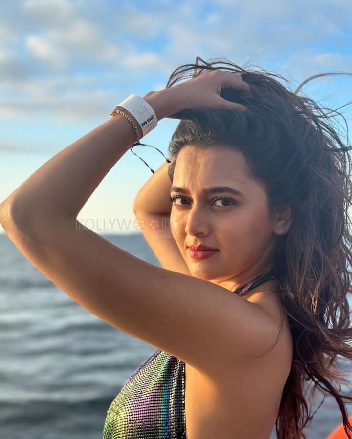 Sexy Tejasswi Prakash in a Shiny Halter Neck Dress Vacation Photos 01