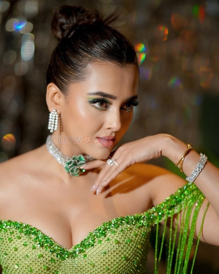Stunning Bold Tejasswi Prakash in a Green Thigh Slit Off Shoulder Dress Photos 02