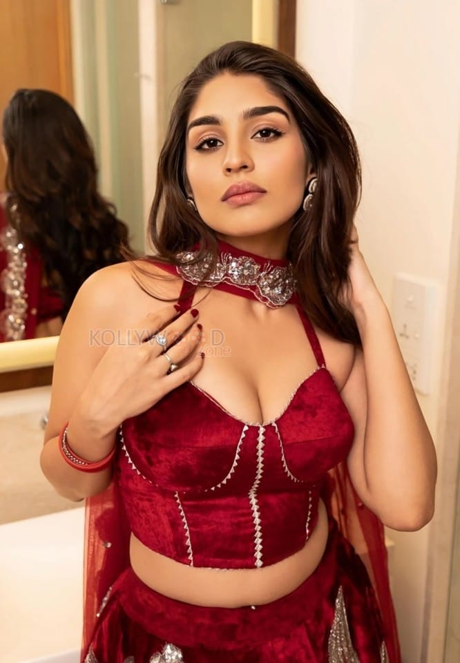 Captivating Yukti Thareja in a Red Deep Neck Cleavage Lehenga Photos 01