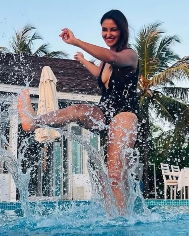 Hot and Erotic Nikita Dutta Boobs Cleavage in an One Piece Swimsuit Photos 02