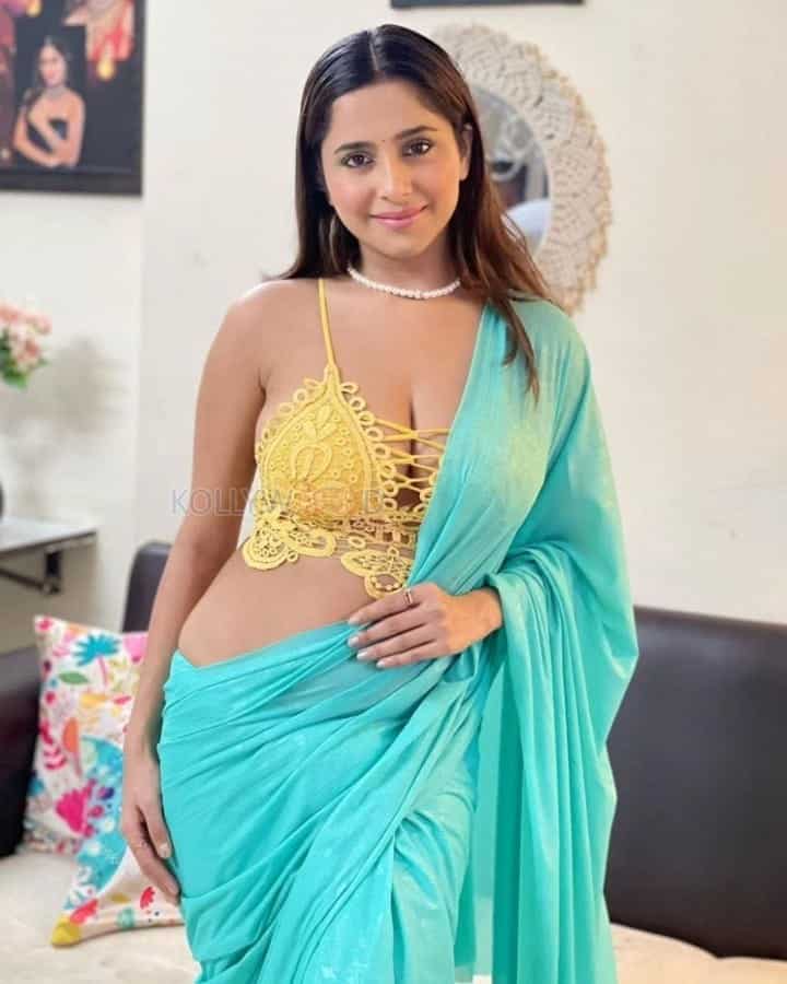 Glamorous Kate Sharma in a Blue Saree and Deepneck Bralette Top Photos 03