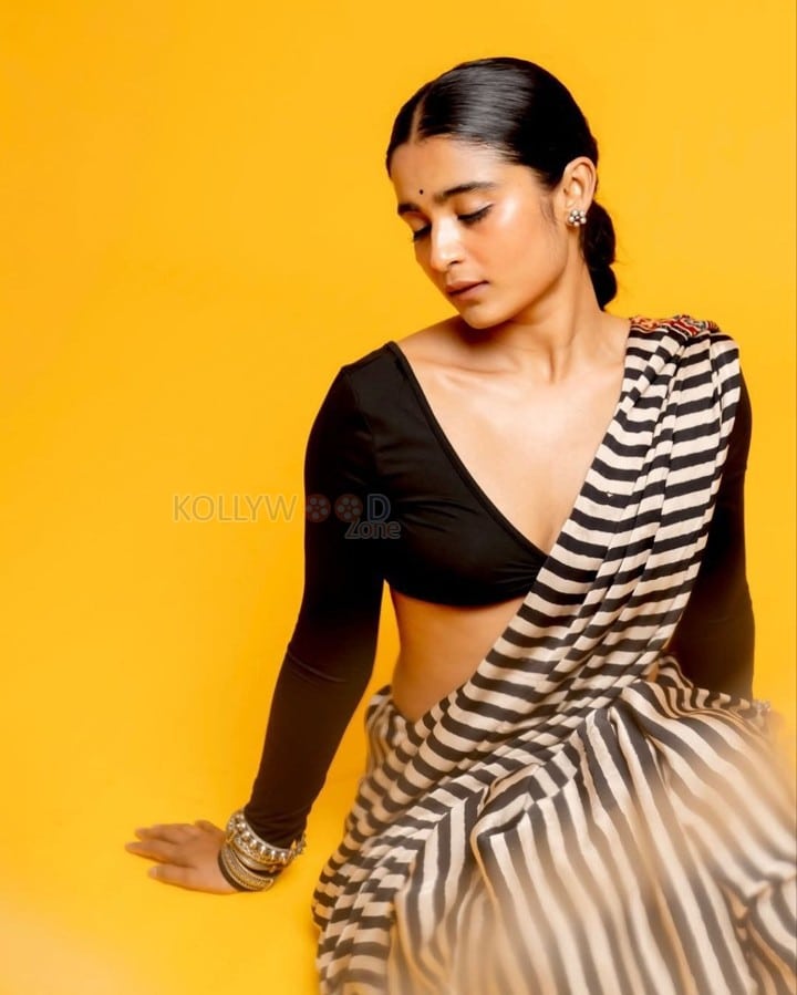 3BHK Actress Chaithra J Achar in a Striped Black and White Saree with a Deep Cut Long Sleeve Blouse Photos 08