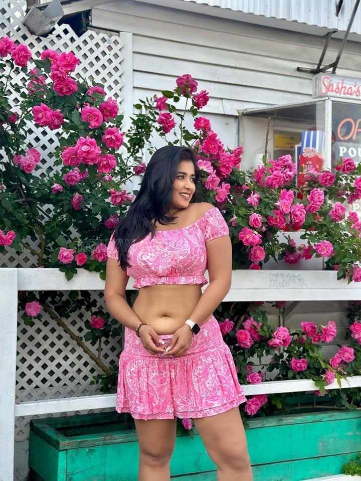 Beautiful Indian Beauty Nikita Sharma Navel in a Pink Mini Skirt and Crop Top Photos 04