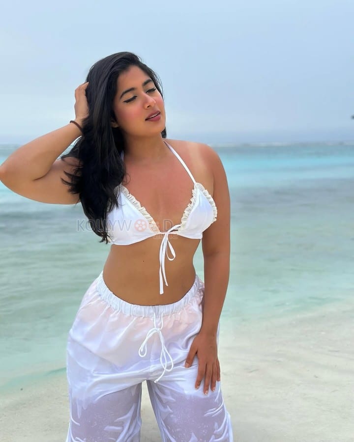 Glam Nikita Sharma in a White Bra and Transparent Pants at the Beachside Photos 04