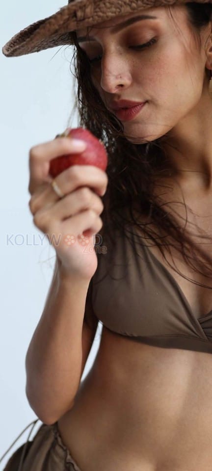 Gorgeous Tripti Dimri Eating Apple in a Chocolate Bikini Photos 03