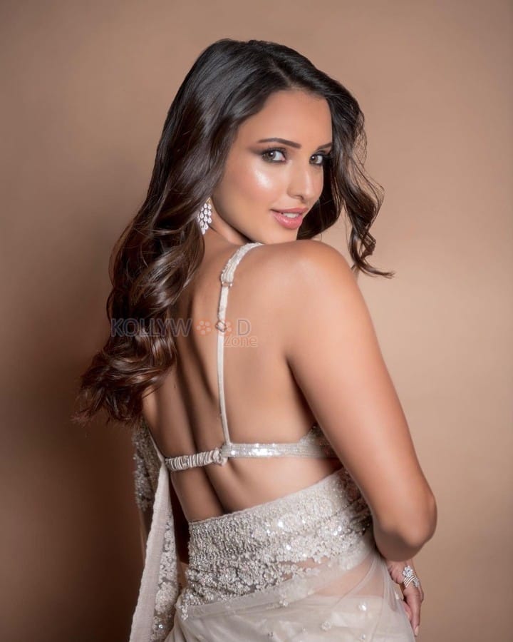 Qala Heroine Tripti Dimri in a White See Through Embellished Saree with a White Sequin Bralette Photos 03