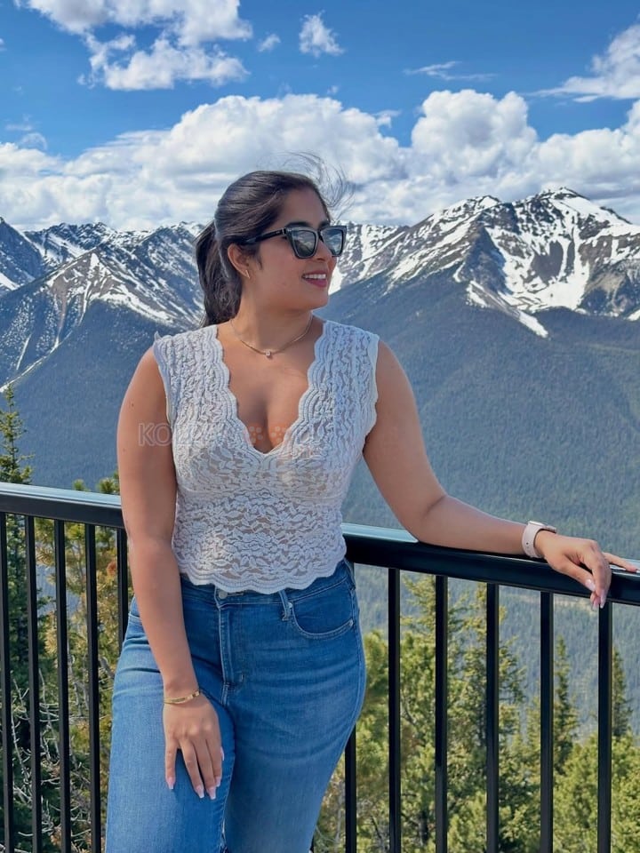 Stunning Nikita Sharma in a White Lace Top and Blue Denim Jeans Photos 02