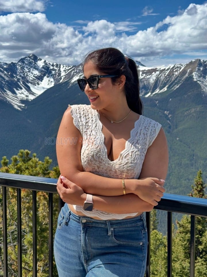 Stunning Nikita Sharma in a White Lace Top and Blue Denim Jeans Photos 03