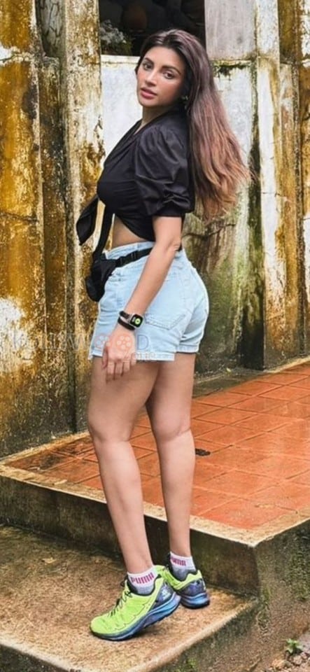 Sexaholic Actress Shama Sikander in a Mini Denim Shorts and Satin Black Top Photos 02