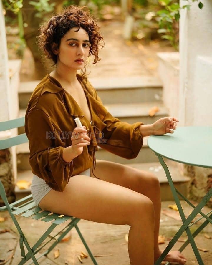 Adorable Megha Shukla in a Mustard Brown Shirt and Boy Shorts Photos 04