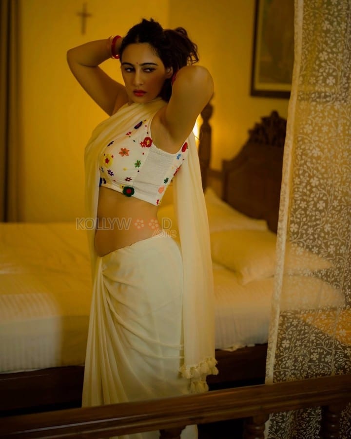 Sexy Megha Shukla in a White Saree and Printed Sleeveless Blouse Photos 02