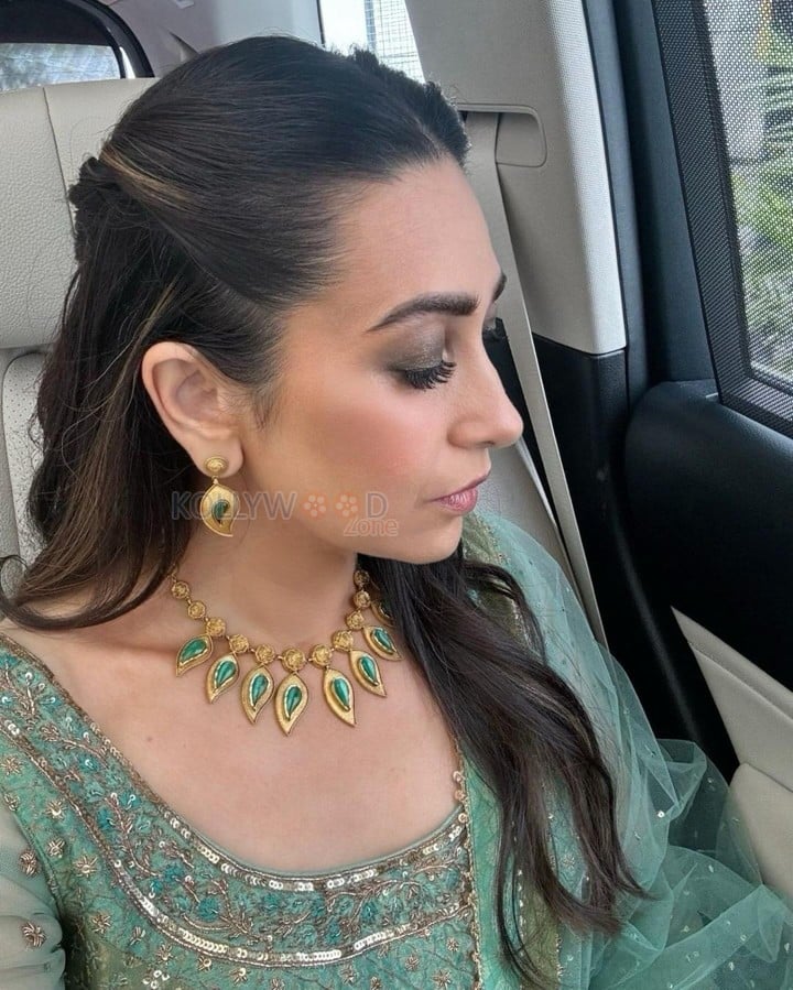 Bollywood Actress Karisma Kapoor in a Green Anarkali Dress Pictures 04