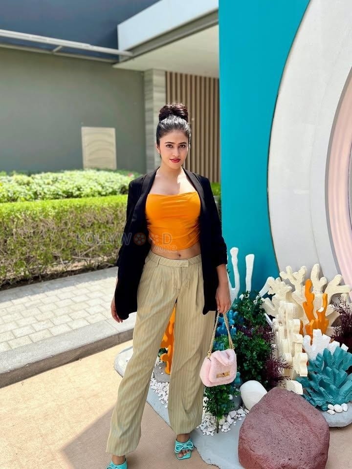 Sexy Shobhita Rana in an Orange Crop Top Black Jacket and Beige Pant Pictures 03