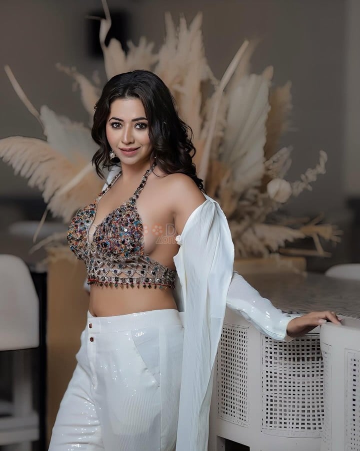 Sparkling Beauty Ridhiema Tiwari in a Sleeveless Bejewelled Bralette and White Pant Photos 02