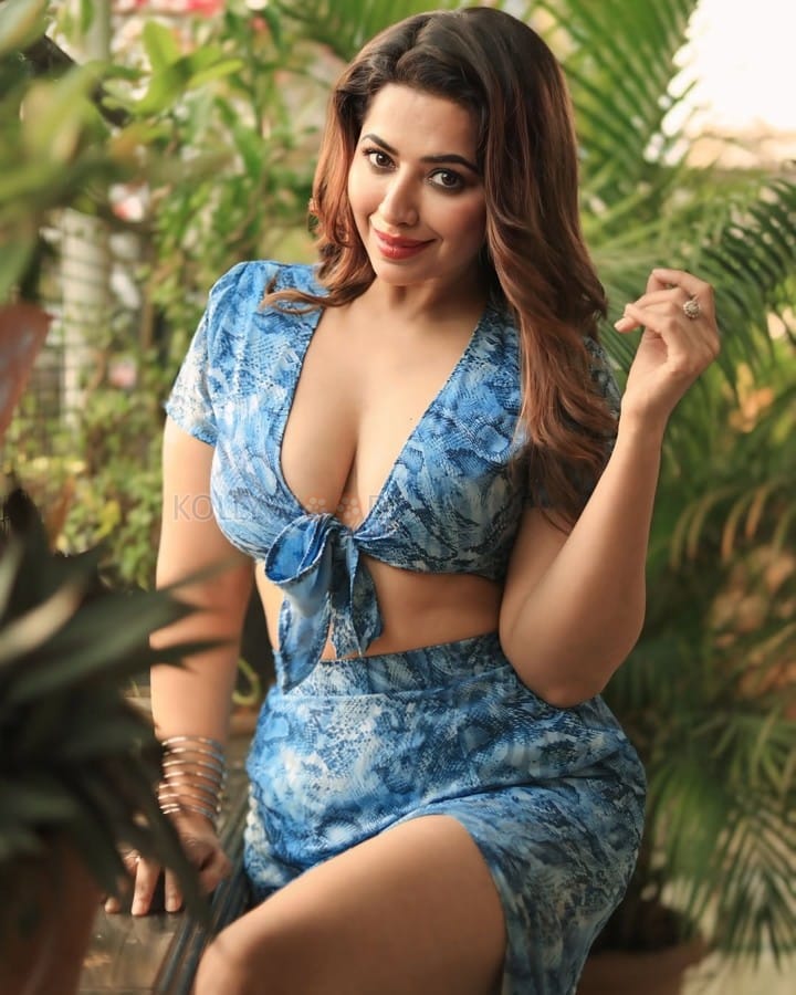 Stylish and Sexy Ridhima Tiwari in a Blue Plunging Neck Line Knotted Crop Top with a Matching Skirt Photos 02