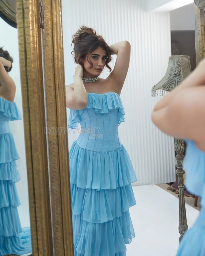 Actress Rasha Thadani in a Blue off Shoulder Corset Style Ruffle Gown Photos 01