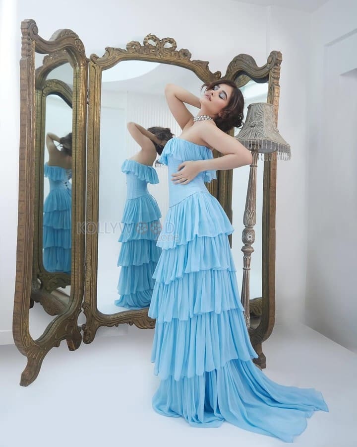 Actress Rasha Thadani in a Blue off Shoulder Corset Style Ruffle Gown Photos 02