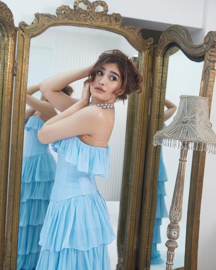 Actress Rasha Thadani in a Blue off Shoulder Corset Style Ruffle Gown Photos 05