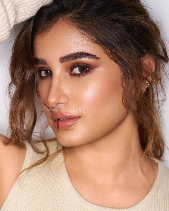 Charming Rasha Thadani in a Cold Shoulder Sweater Dress Photos 01