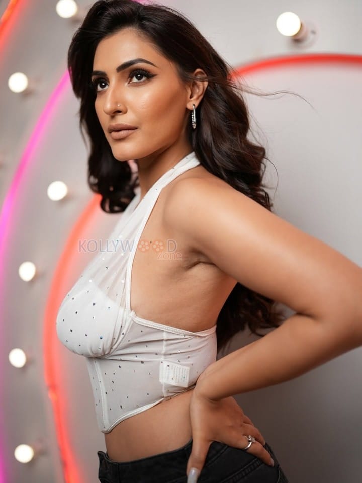 Glam Shivangi Verma in a White Sleeveless Halter Corset Top with a High Waisted Black Pants 02