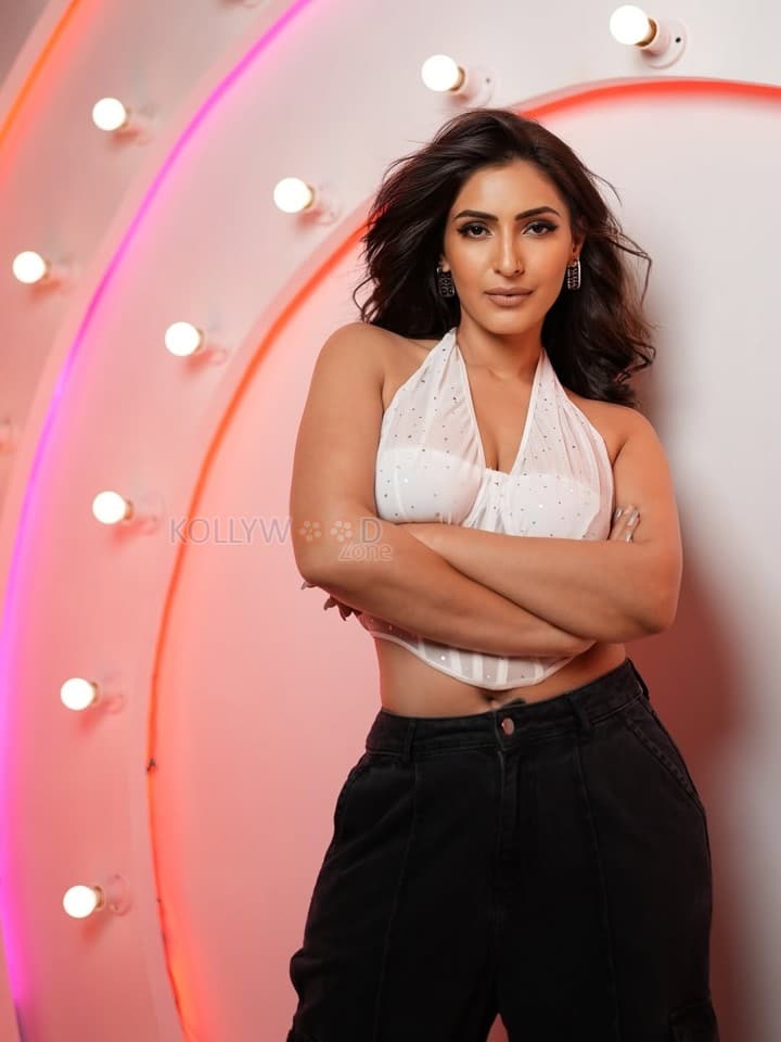 Glam Shivangi Verma in a White Sleeveless Halter Corset Top with a High Waisted Black Pants 04