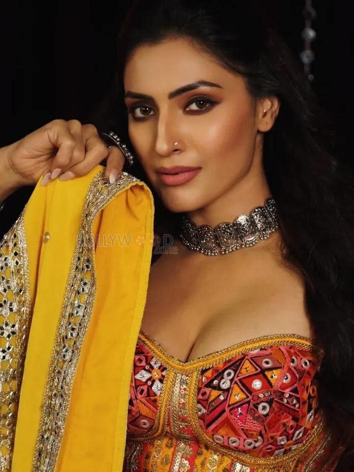 Hot Shivangi Verma in a Multi Coloured Designer Lehenga Gown with a Sleeveless Deep Neck Top Photos 02