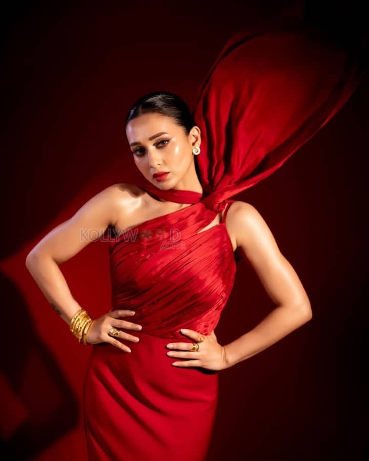 Glamorous Mimi Chakraborty in a Red Satin Halterneck Gown Photos 04