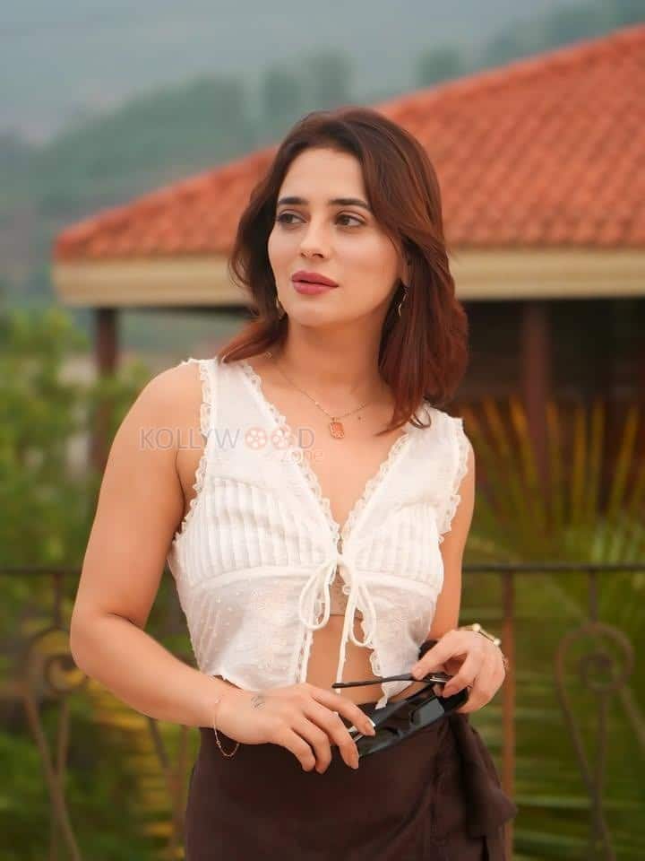 Sexy Hot Priyanka Rewri in a White Sleeveless Crop Top and Brown Tie Up Skirt Photos 01