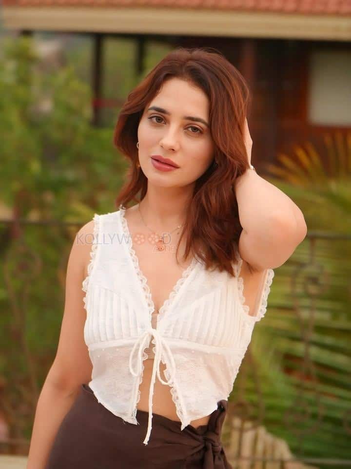 Sexy Hot Priyanka Rewri in a White Sleeveless Crop Top and Brown Tie Up Skirt Photos 02