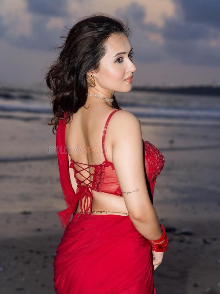 Glamorous Varsha Rekhate in a Red Saree with an Embellished Sleeveless Blouse Photos 03