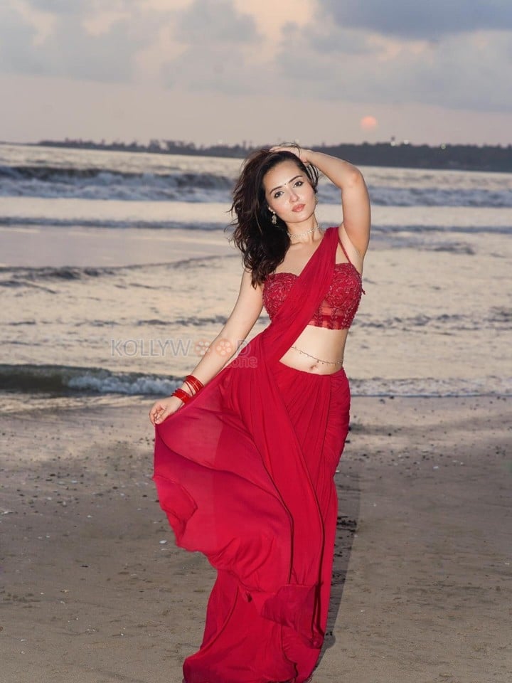 Glamorous Varsha Rekhate in a Red Saree with an Embellished Sleeveless Blouse Photos 07