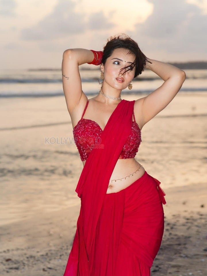 Glamorous Varsha Rekhate in a Red Saree with an Embellished Sleeveless Blouse Photos 08