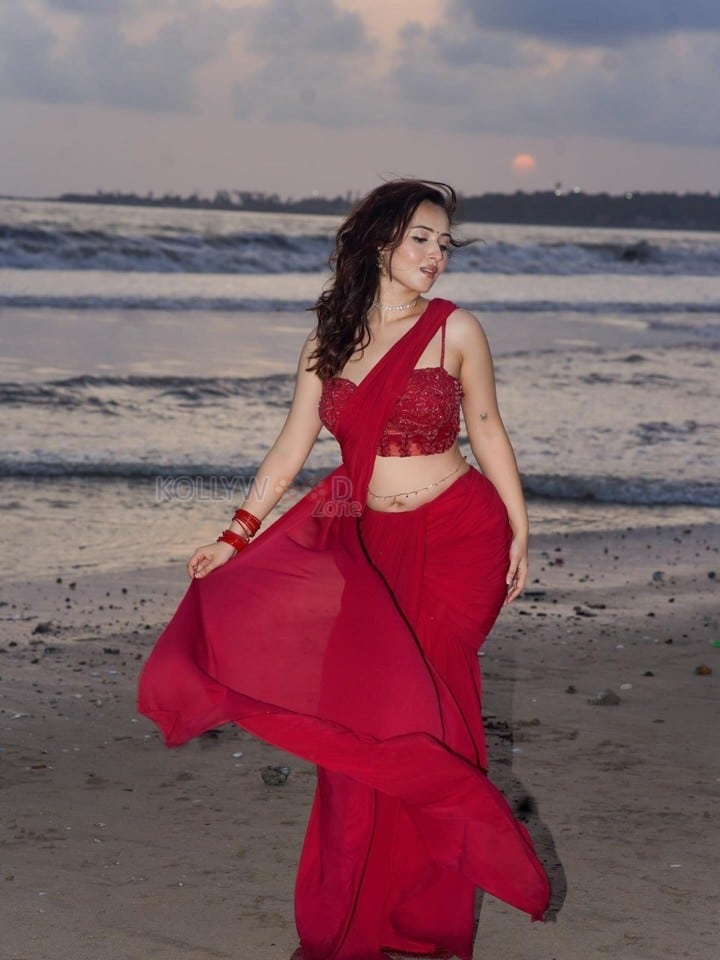 Glamorous Varsha Rekhate in a Red Saree with an Embellished Sleeveless Blouse Photos 09