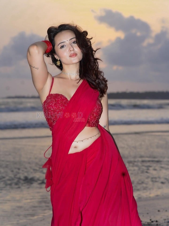 Glamorous Varsha Rekhate in a Red Saree with an Embellished Sleeveless Blouse Photos 10