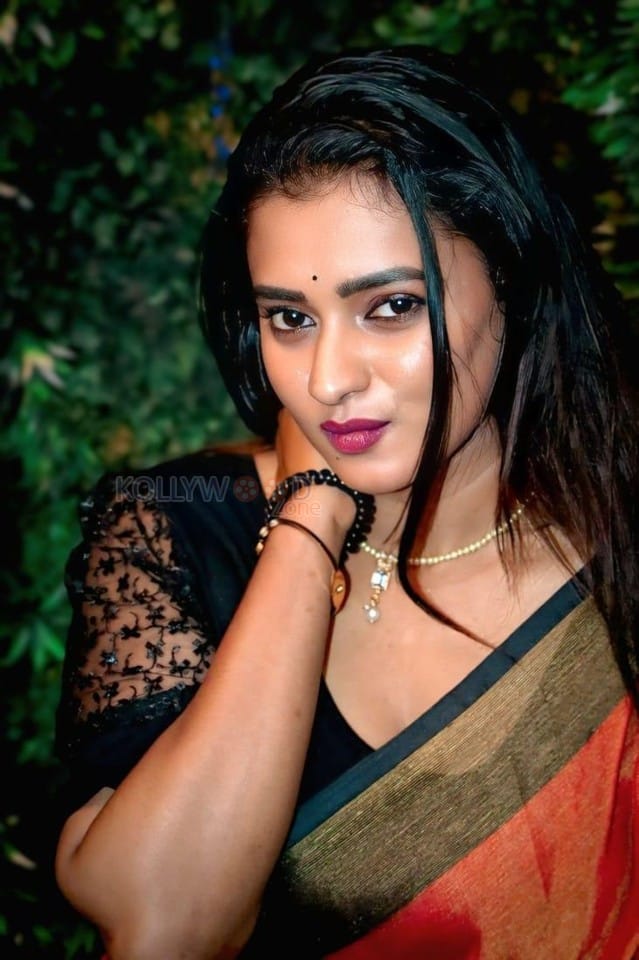 Actress Chaitra Ram in a Red Saree with a Black Blouse Photos 01