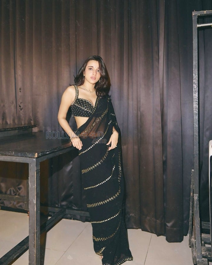 Sexy Nuveksha in a Black Saree with Delicate Golden Sequin Stripes and a Sleeveless Blouse Pictures 10