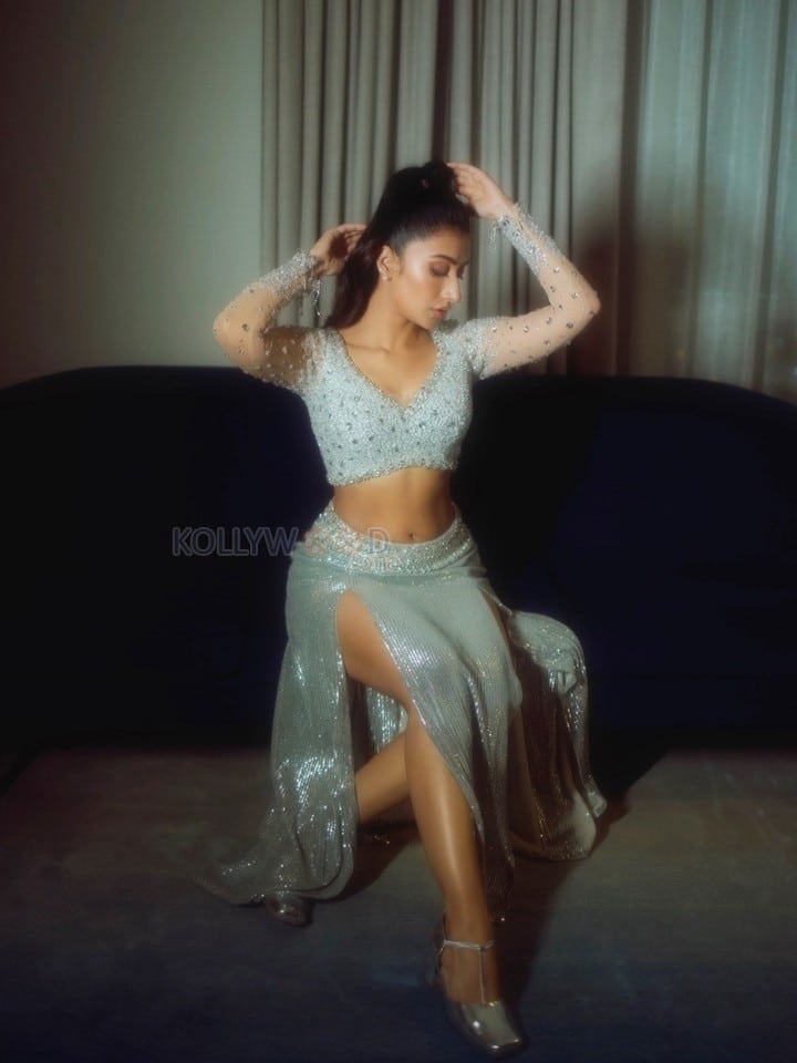 Sexy Dhanashree Verma in an Icy Light Blue Two Piece Sequin Outfit with a Long Sleeved Deep V Neck Crop Top with a Matching Thigh High Slit Pictures 08