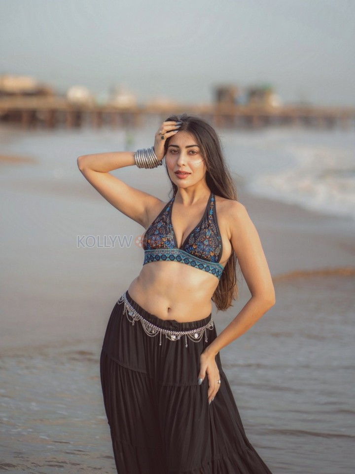 Sexy Ruma Sharma in a Bohemian Style Halter Neck Top with a Black Tiered Skirt Photos 01