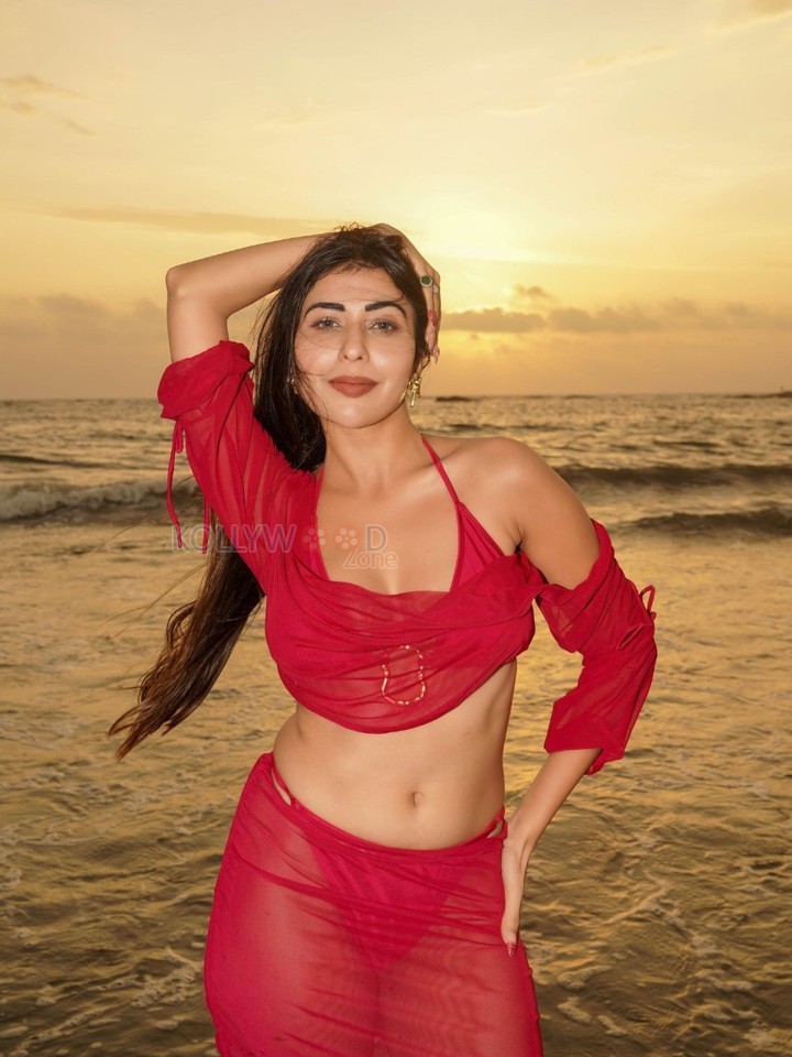 Temptation Island Beauty Ruma Sharma in a Red Sheer Long Sleeved Crop Top and Mini Skirt over a Bikini Photos 01